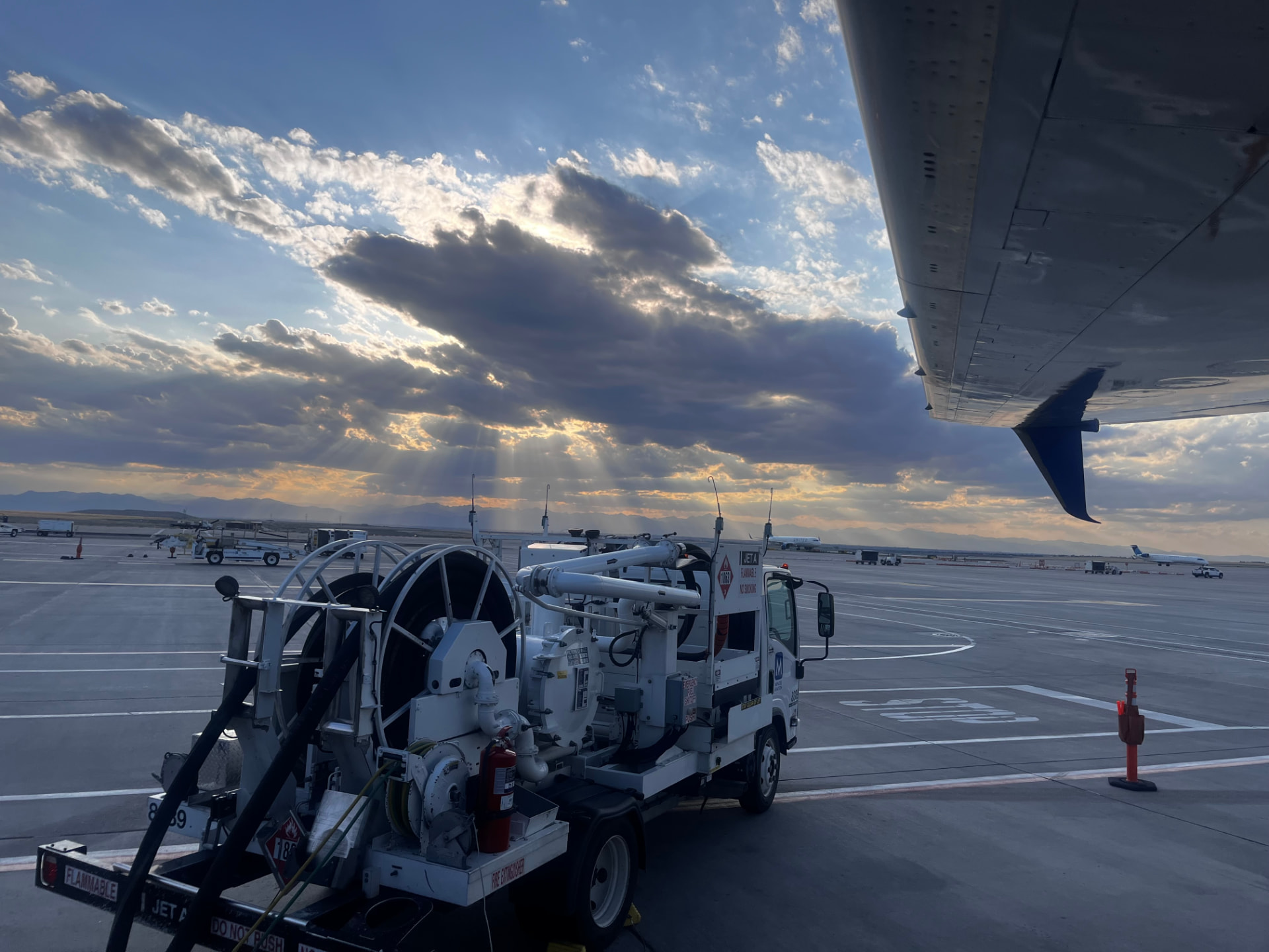 Jet fuel truck on the ramp at Denver International Airport at sunrise